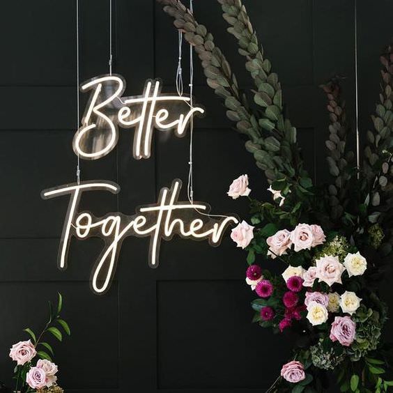 Better Together Neon Sign on black wall