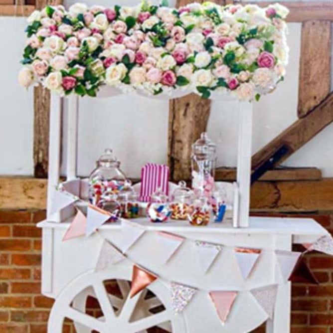 luxury candy cart with sweets and flowers