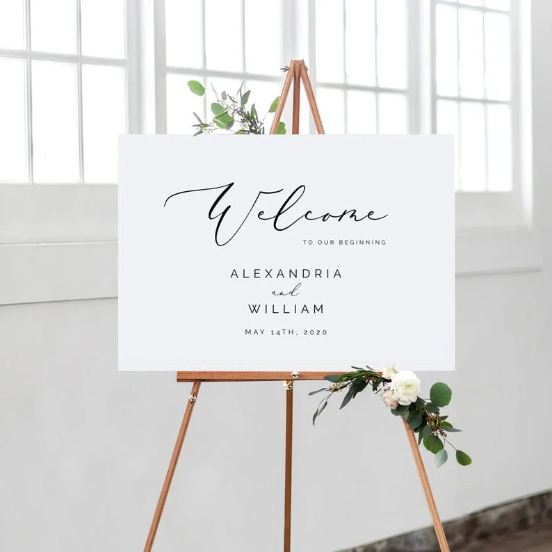 White Welcome Sign Alexandria & William on wooden easel