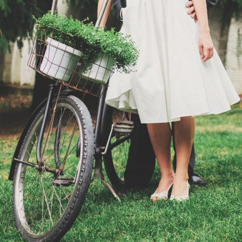 postpone 1 bride in front of bicycle