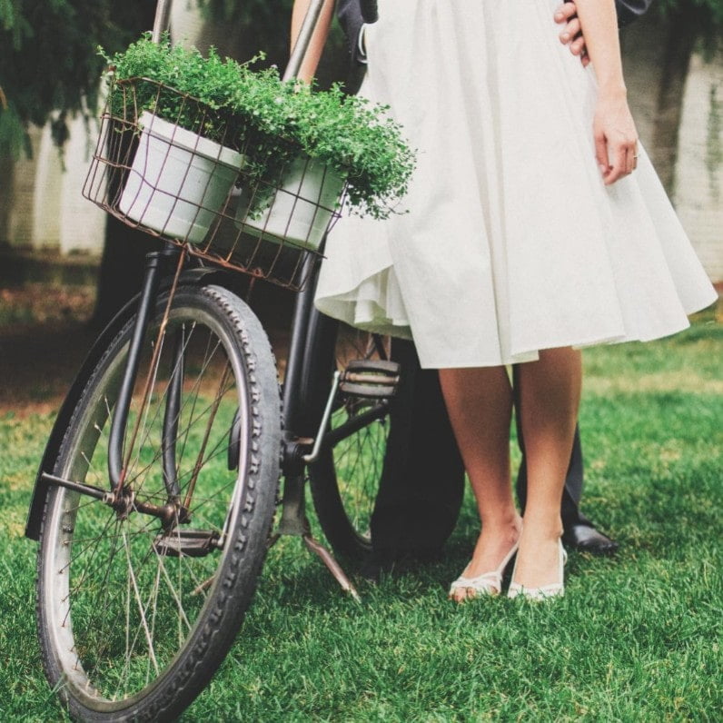 bride in front of bicycle